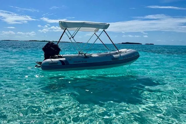 Here & Now Yacht Photos Pics A Catalina 445 sailboat in clear turquoise water under a sunny sky, 2021 model.
