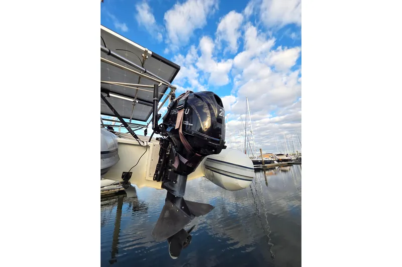 Here & Now Yacht Photos Pics Catalina 445 sailboat with outboard motor and solar panels, docked in a marina, 2021 model.