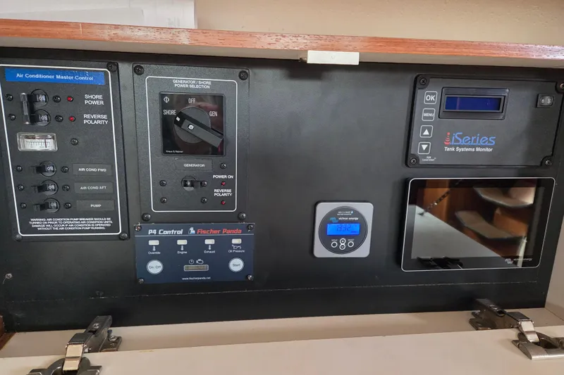 Here & Now Yacht Photos Pics Control panel of a 2021 Catalina 445 yacht with various system monitors.