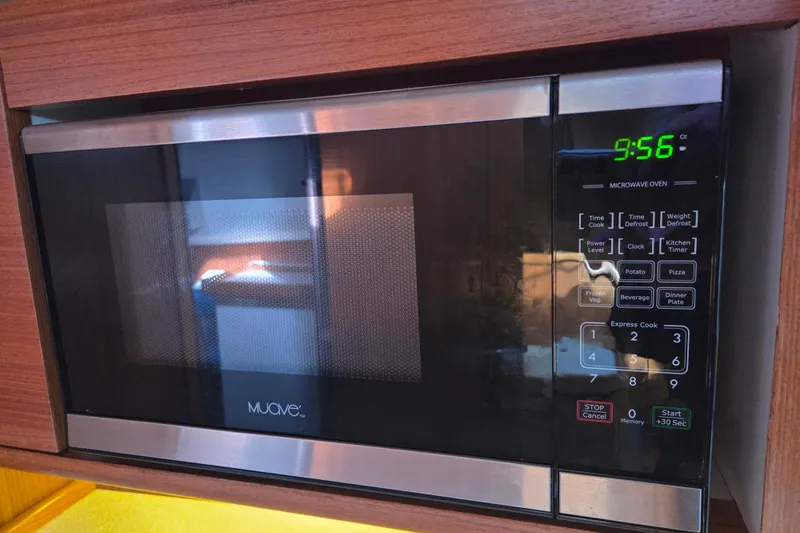 Here & Now Yacht Photos Pics Microwave oven in Catalina 445, 2021 model, with digital display and control panel.