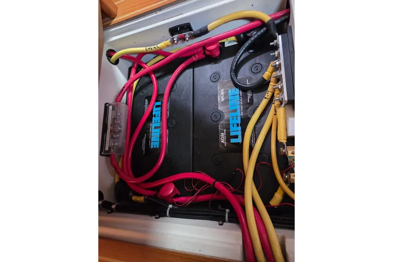 Here & Now Yacht Photos Pics Catalina 445 2021 boat battery compartment with Lifeline AGM battery and wiring.