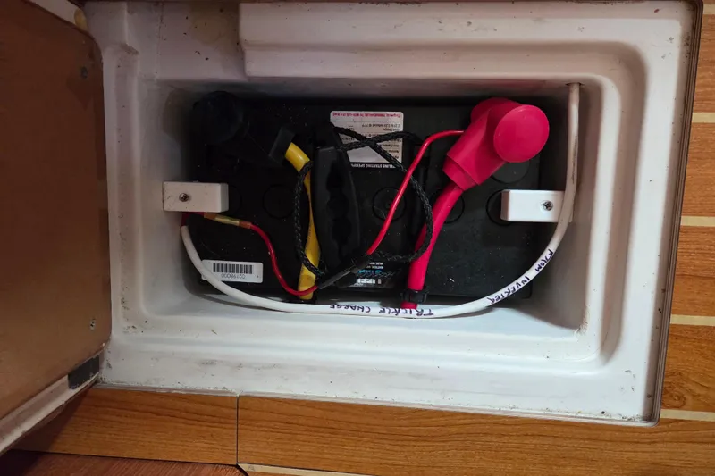 Here & Now Yacht Photos Pics Battery compartment of a 2021 Catalina 445 sailboat with connected cables.