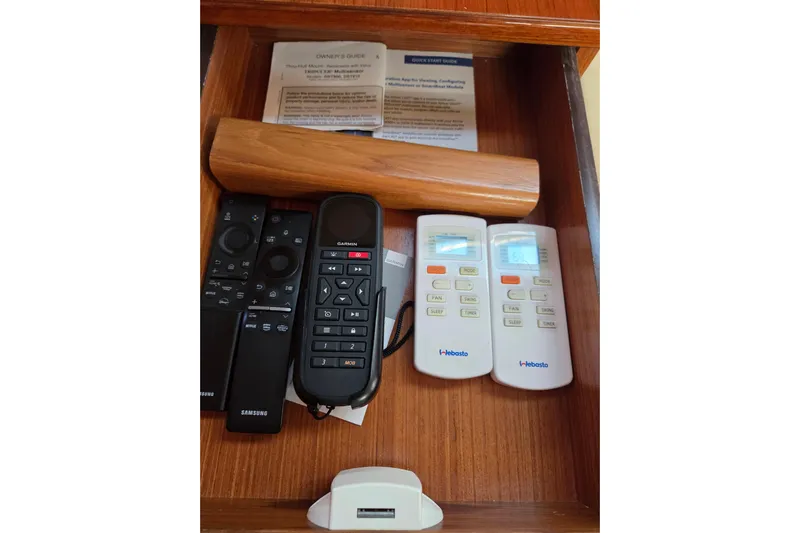 Here & Now Yacht Photos Pics Drawer with remotes and guides in a 2021 Catalina 445 yacht.