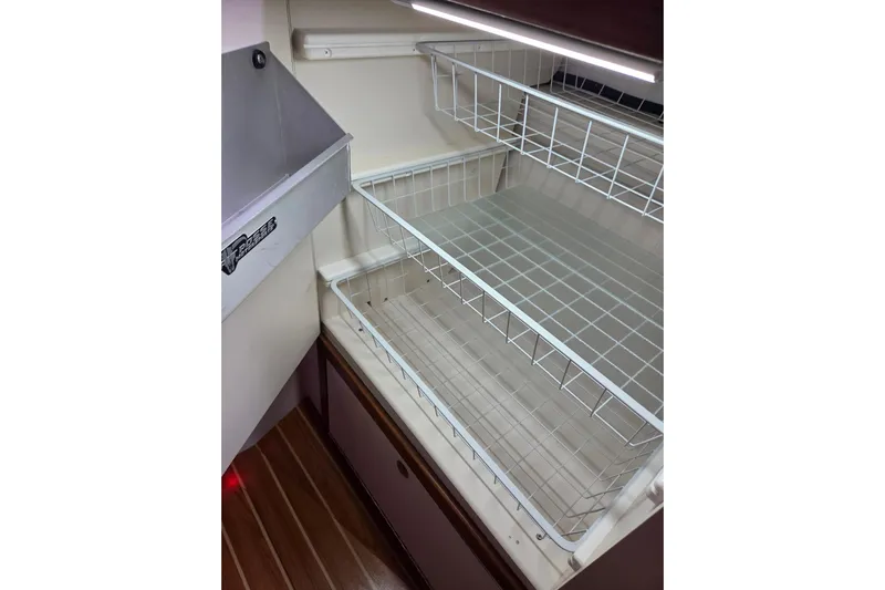 Here & Now Yacht Photos Pics Interior storage shelves in a 2021 Catalina 445 yacht.