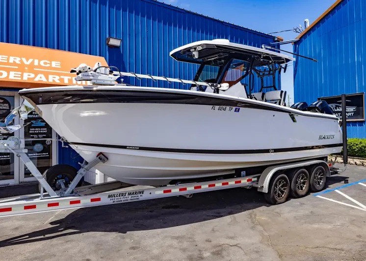  Yacht Photos Pics 2023 Blackfin 272 CC boat on trailer outside service department.