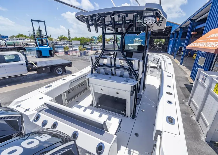  Yacht Photos Pics 2023 Blackfin 272 CC boat at a marina, showcasing sleek design and modern features.