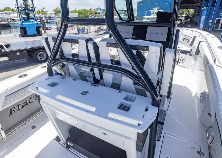  Yacht Photos Pics 2023 Blackfin 272 CC boat interior with seating and Garmin electronics.