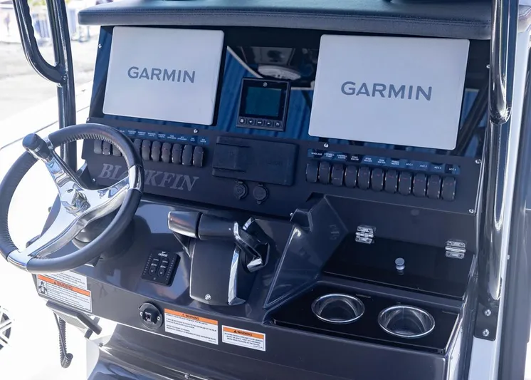  Yacht Photos Pics 2023 Blackfin 272 CC boat dashboard with dual Garmin displays and steering wheel.