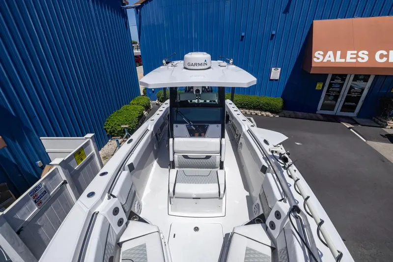  Yacht Photos Pics 2023 Blackfin 272 CC boat at sales center, featuring spacious deck and modern design.