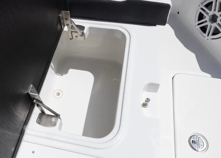  Yacht Photos Pics Open storage compartment on 2023 Blackfin 272 CC boat, featuring stainless steel hinges.