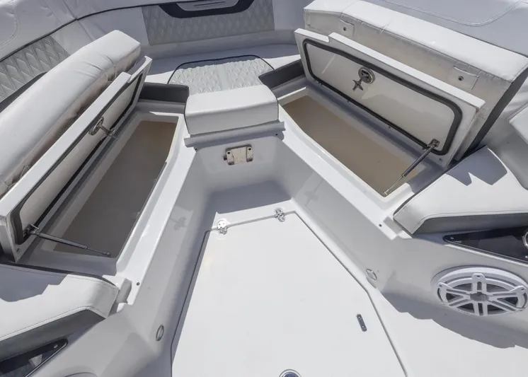  Yacht Photos Pics 2023 Blackfin 272 CC boat interior with open storage compartments and cushioned seating.