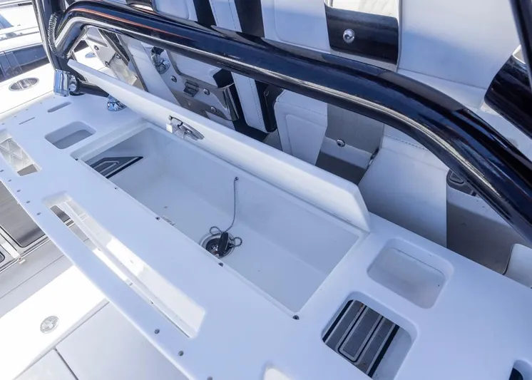  Yacht Photos Pics 2023 Blackfin 272 CC boat interior with storage compartment and sleek design.