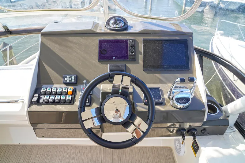  Yacht Photos Pics Helm of 2020 Carver C40 yacht with modern navigation controls and steering wheel.