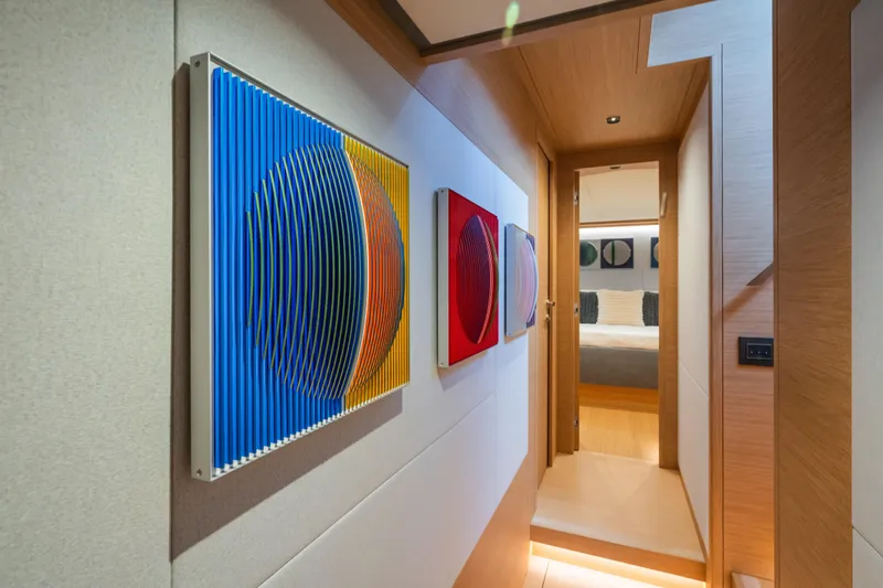 Simon Yacht Photos Pics Hallway of 2024 Pardo Yachts GT75 featuring modern art and wooden accents.