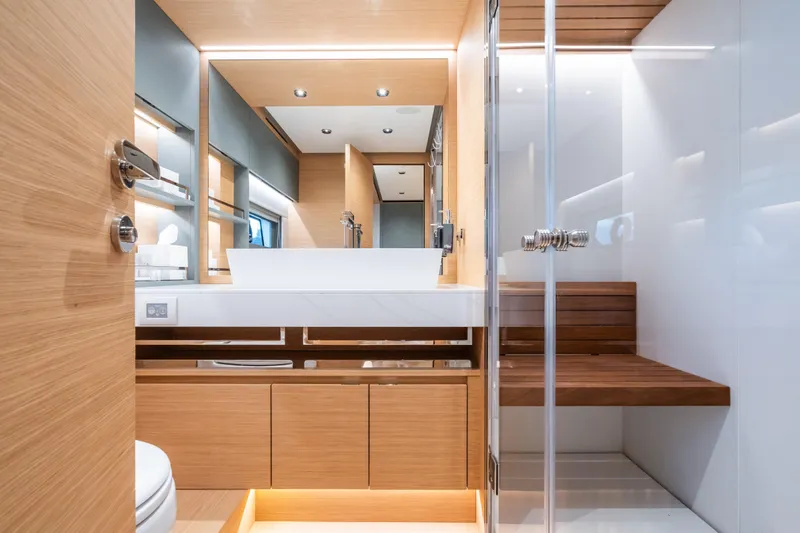 Simon Yacht Photos Pics Luxurious bathroom interior of 2024 Pardo Yachts GT75, featuring modern wood and glass design.
