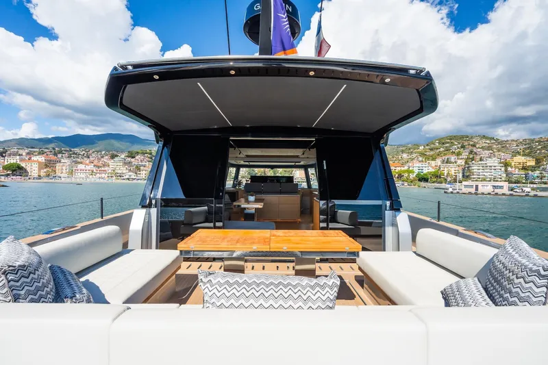 Simon Yacht Photos Pics Luxurious 2024 Pardo Yachts GT75 with elegant outdoor seating and scenic coastal backdrop.