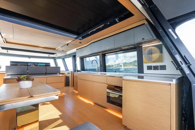 Simon Yacht Photos Pics Luxurious interior of 2024 Pardo Yachts GT75 with modern kitchen and scenic ocean view.