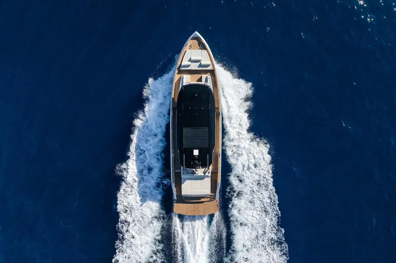 Simon Yacht Photos Pics Aerial view of 2024 Pardo Yachts GT75 cruising on open blue sea.