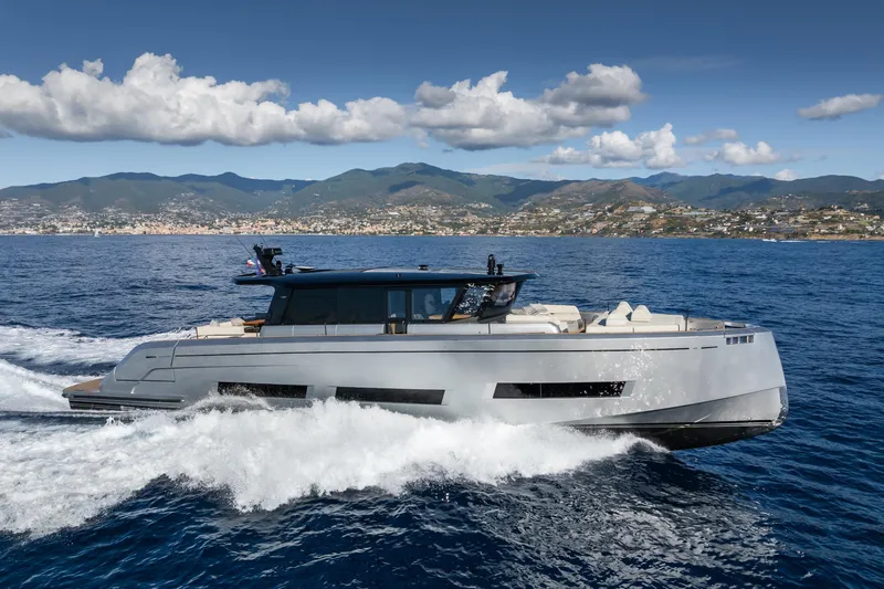 Simon Yacht Photos Pics 2024 Pardo Yachts GT75 cruising on open water with scenic mountain backdrop.
