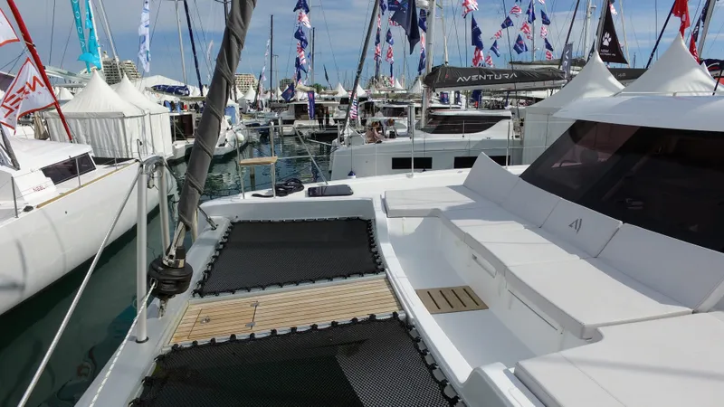 Tbd Yacht Photos Pics 2025 Aventura 45 catamaran at a boat show, featuring sleek design and spacious deck.