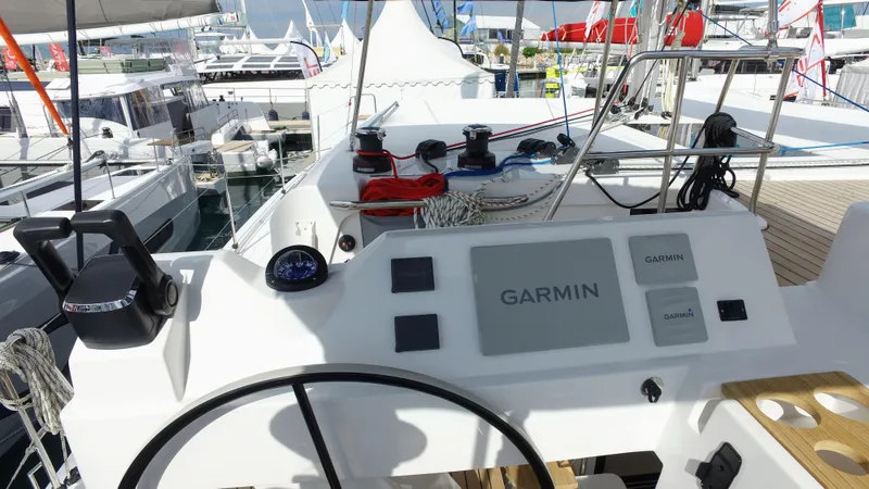 Tbd Yacht Photos Pics Helm of 2025 Aventura 45 yacht with Garmin navigation system at a marina.
