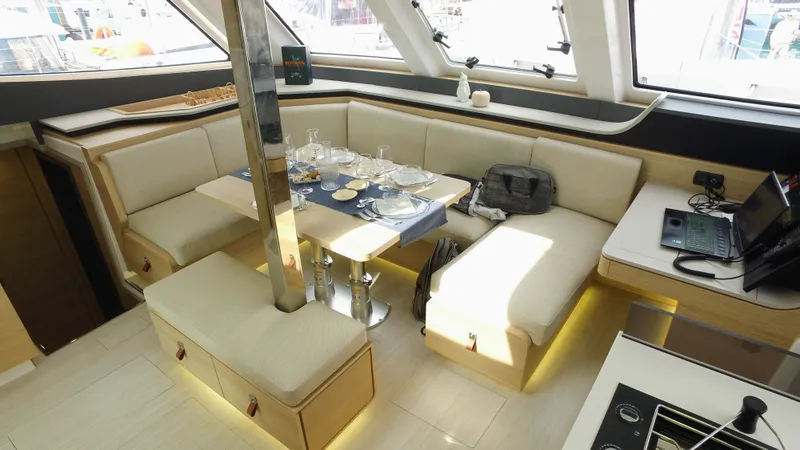 Tbd Yacht Photos Pics Luxurious interior of 2025 Aventura 45 yacht with elegant dining area and modern amenities.