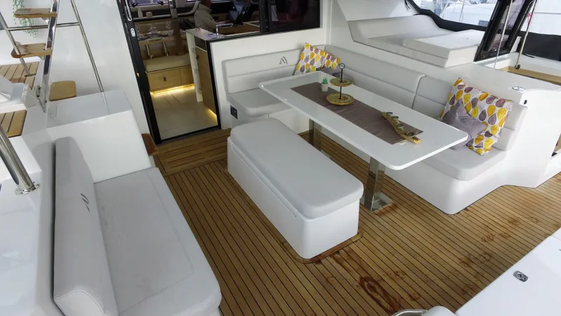 Tbd Yacht Photos Pics Aventura 45 yacht interior, 2025 model, featuring elegant seating and a modern dining area.