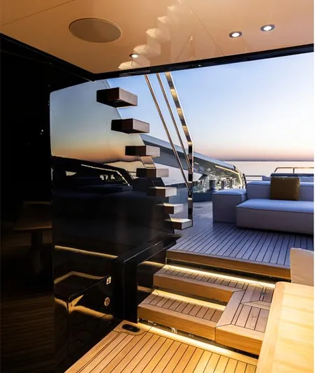 Doge 400 Yacht Photos Pics Luxurious Ocean King Doge 400 yacht interior, 2027 model, with modern staircase and sunset view.