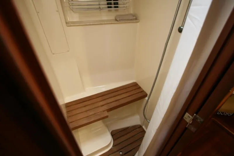 Sailing Diver Yacht Photos Pics 2010 Hunter 49 Aft Cockpit shower with wooden bench and window.