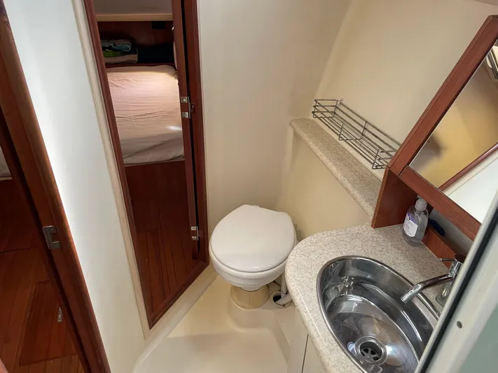 Sailing Diver Yacht Photos Pics 2010 Hunter 49 Aft Cockpit bathroom with sink, toilet, and mirror.