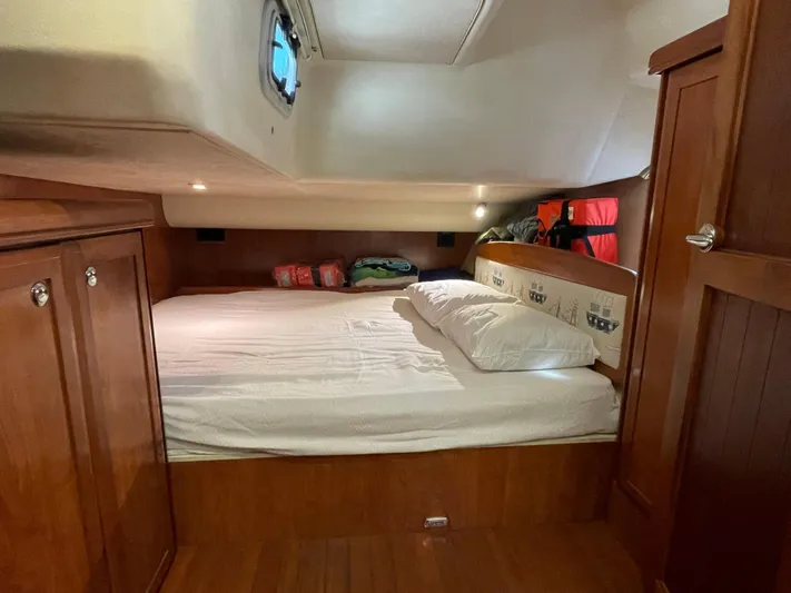 Sailing Diver Yacht Photos Pics Cozy cabin interior of 2010 Hunter 49 Aft Cockpit yacht with wooden furnishings.