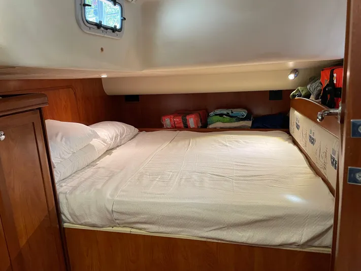 Sailing Diver Yacht Photos Pics Cozy cabin interior of 2010 Hunter 49 Aft Cockpit sailboat with comfortable bedding.