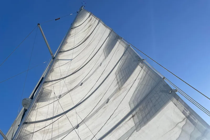 Sailing Diver Yacht Photos Pics Sail of 2010 Hunter 49 Aft Cockpit against clear blue sky.