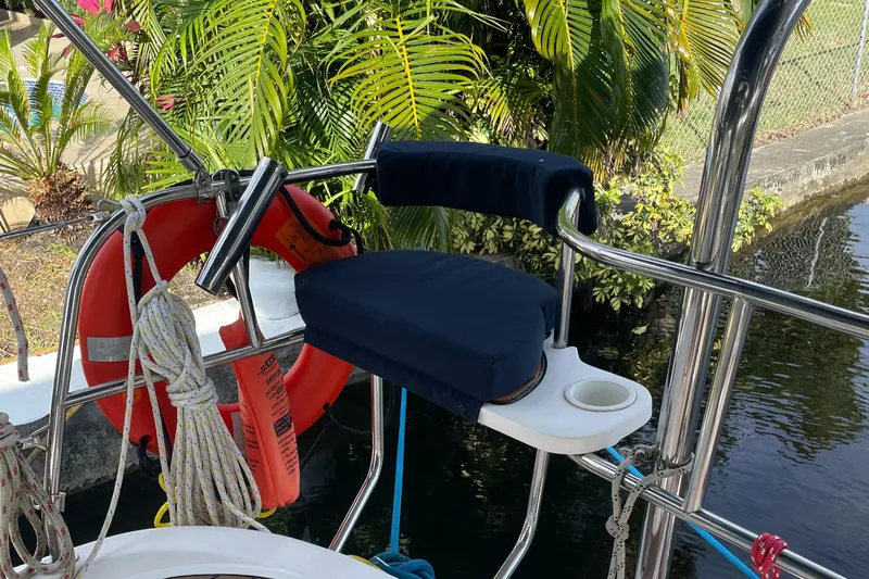 Sailing Diver Yacht Photos Pics Aft cockpit of 2010 Hunter 49 sailboat with cushioned seat and safety equipment.