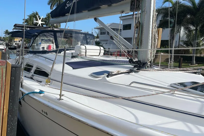 Sailing Diver Yacht Photos Pics 2010 Hunter 49 Aft Cockpit sailboat docked, featuring sleek design and modern amenities.