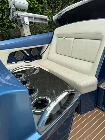  Yacht Photos Pics Luxurious seating on 2013 Nor-Tech 420 Monte Carlo boat with sleek design and cup holders.