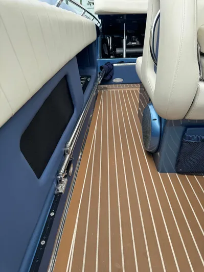  Yacht Photos Pics 2013 Nor-Tech 420 Monte Carlo interior with sleek seating and wood-patterned flooring.