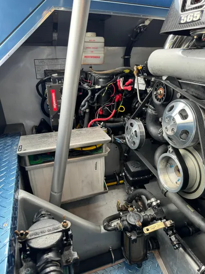  Yacht Photos Pics Engine compartment of 2013 Nor-Tech 420 Monte Carlo boat, showcasing mechanical components.