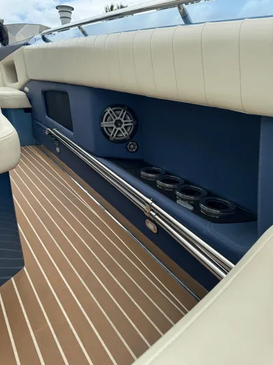  Yacht Photos Pics 2013 Nor-Tech 420 Monte Carlo interior with blue and white seating, speaker, and cup holders.