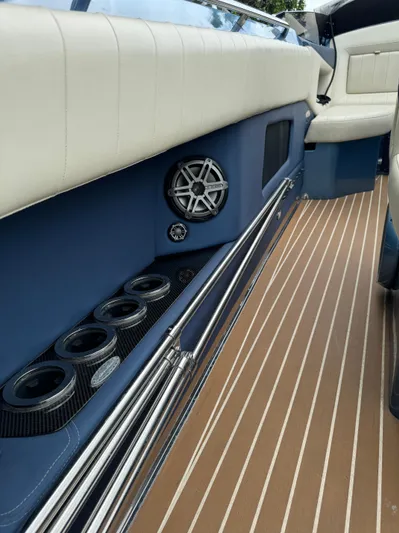  Yacht Photos Pics 2013 Nor-Tech 420 Monte Carlo interior with blue accents and striped flooring.