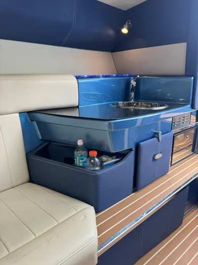  Yacht Photos Pics 2013 Nor-Tech 420 Monte Carlo interior with kitchenette and seating area.