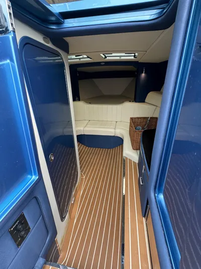  Yacht Photos Pics Interior of 2013 Nor-Tech 420 Monte Carlo with sleek blue and wood finish.