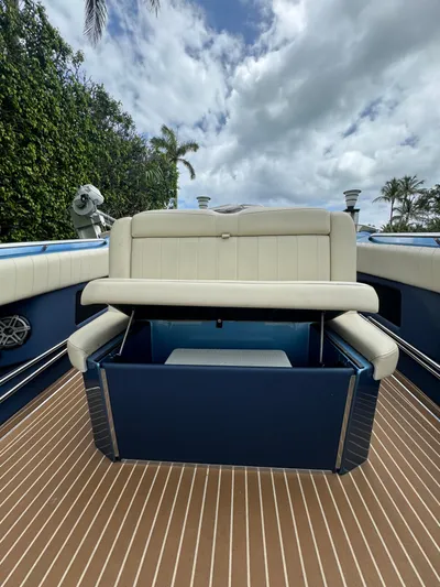  Yacht Photos Pics 2013 Nor-Tech 420 Monte Carlo boat interior with cushioned seating and storage.