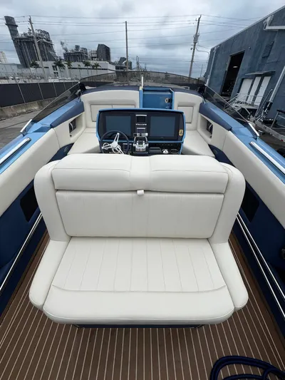  Yacht Photos Pics 2013 Nor-Tech 420 Monte Carlo boat interior with white seating and modern dashboard.