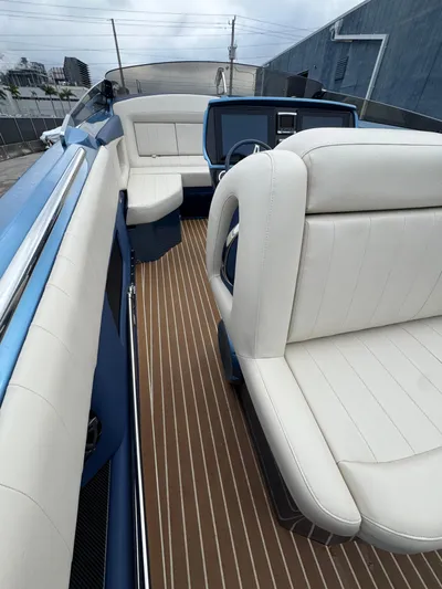  Yacht Photos Pics 2013 Nor-Tech 420 Monte Carlo boat interior with white seating and wood flooring.