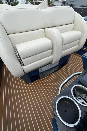  Yacht Photos Pics Luxury seating on 2013 Nor-Tech 420 Monte Carlo boat with sleek design and cup holders.