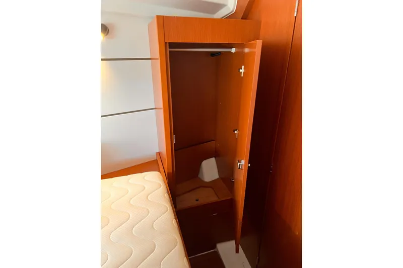 Grey Havens Yacht Photos Pics Interior cabin of 2017 Beneteau Oceanis 38.1 yacht with open wooden closet.