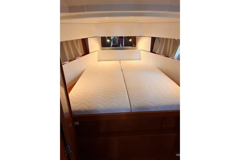 Grey Havens Yacht Photos Pics 2017 Beneteau Oceanis 38.1 yacht cabin with double bed and wooden interior.