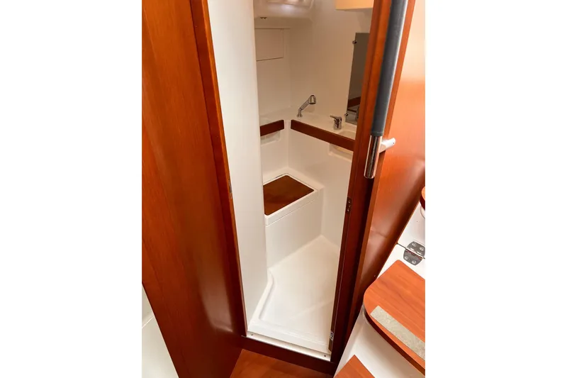 Grey Havens Yacht Photos Pics 2017 Beneteau Oceanis 38.1 yacht interior bathroom with wooden accents and modern fixtures.