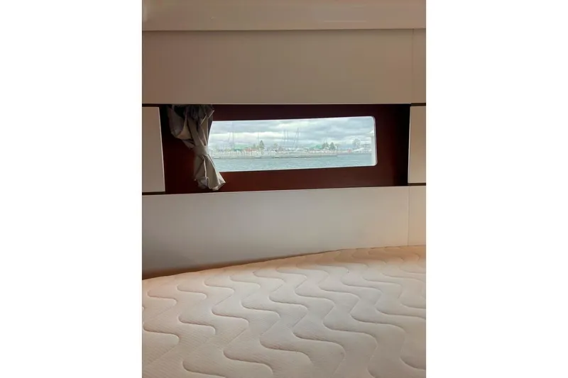 Grey Havens Yacht Photos Pics Interior view of 2017 Beneteau Oceanis 38.1 cabin with window and mattress.